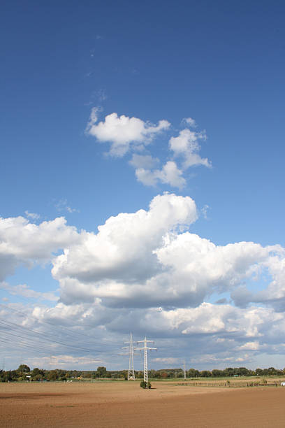 Power Line and Clouds stock photo