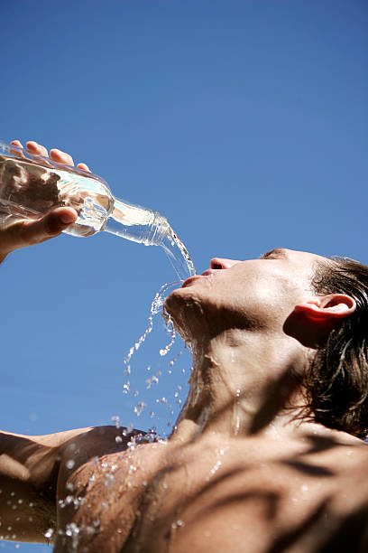istock Young male drinking water from bottle 151535663