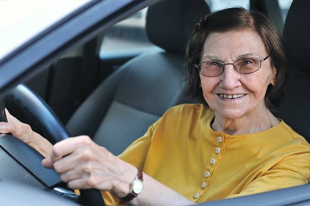 istock Senior woman driving car 151535985