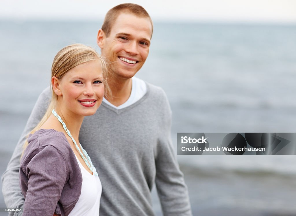 Happy young couple on the beach 20-24 Years Stock Photo