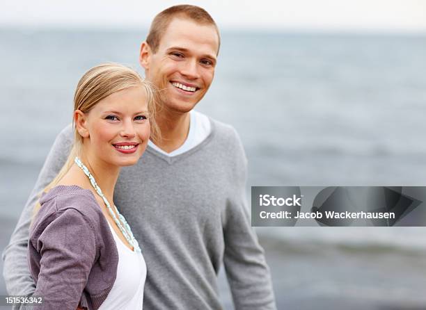 Happy Young Couple On The Beach Stock Photo - Download Image Now - 20-24 Years, Adult, Adults Only