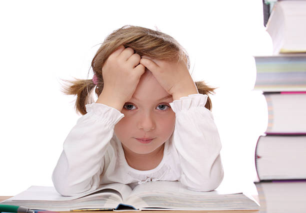 istock Little girl doing homework 151536376