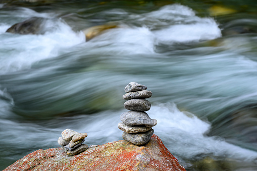 A stack of stones beside a river