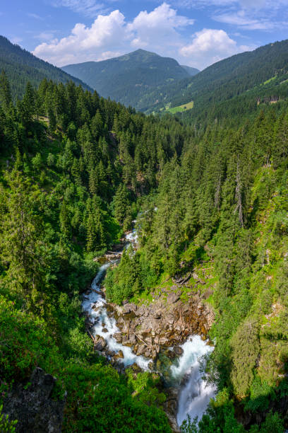 Landscape in the mountains with a winding river in a forest Landscape in the mountains with a winding river in a forest. Silbertal, Montafon, Vorarlberg silbertal stock pictures, royalty-free photos & images
