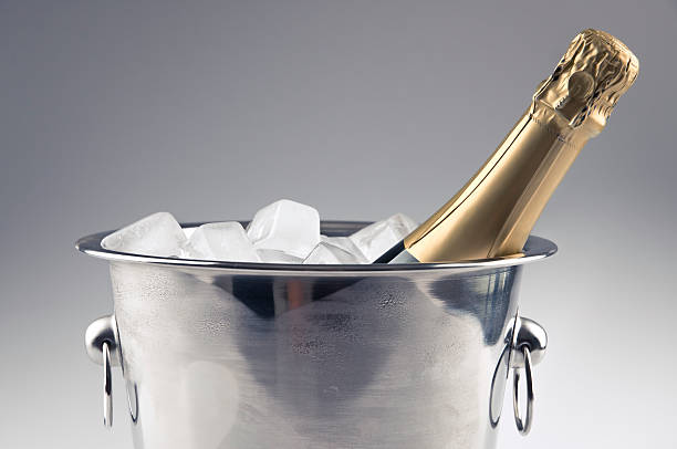 Bottle of champagne and ice bucket stock photo