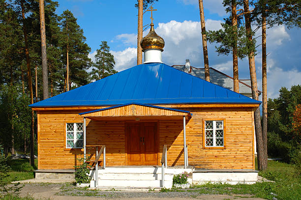 Village church with made of logs walls. stock photo