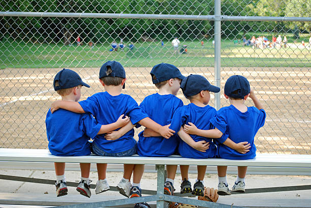 i love my team five little boys put their arms around each other befor their baseball game baseball player photos stock pictures, royalty-free photos & images