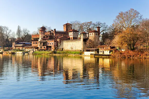 Po river, panoramic view of the beautiful Medieval Village built in the park of Valentino, Turin, in Piedmont, Italy.