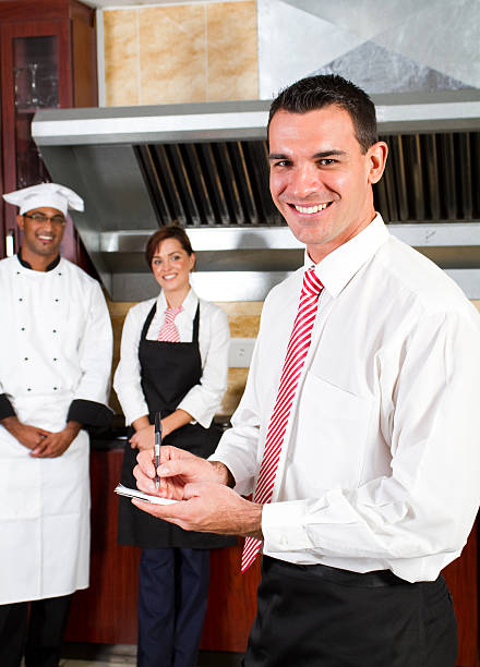 istock restaurant manager and staff 151538890