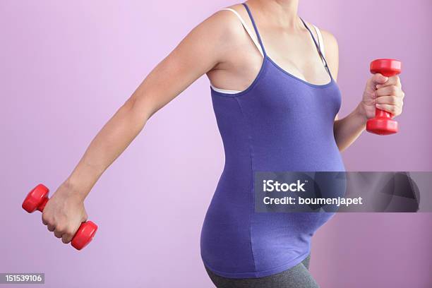 Pregnant Woman Exercising With Handheld Weights Stock Photo - Download Image Now - Abdomen, Active Lifestyle, Activity