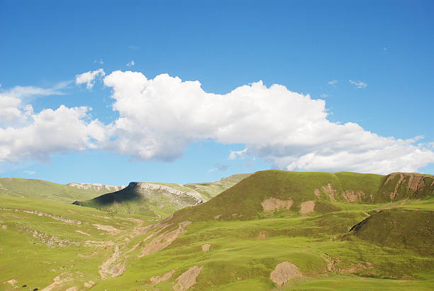 istock The blue sky and green mountain pasture 151539131