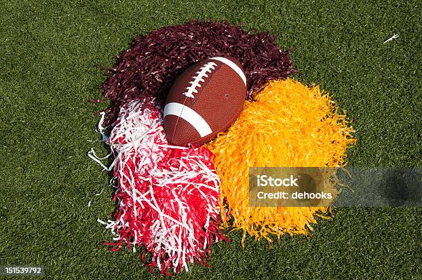 American Football And Pom Poms On Field Stock Photo - Download Image Now - American Football Field, Pom-Pom, American Culture