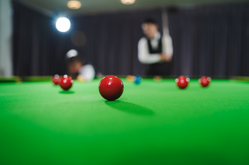 Red ball and snooker players focus red ball