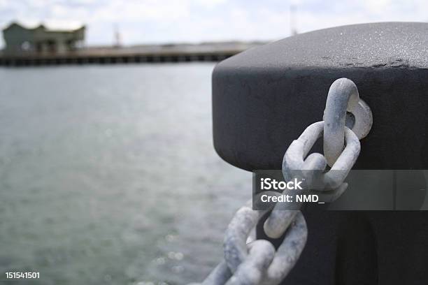 Concrete Piller With Chains By The Seaside Stock Photo - Download Image Now - Chain - Object, Horizontal, No People