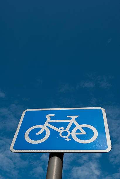 istock Cycling lane sign with blue sky 151542027