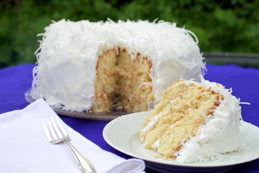 Coconut Cake covered in Meringue and freshly-grated Coconut