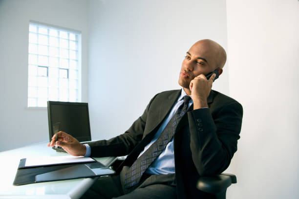istock Businessman on cellphone. 151542456