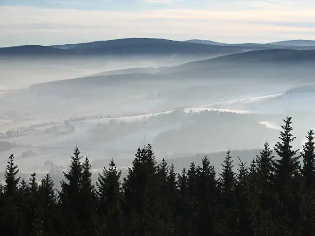 A umava mountains in winter under the snow in the magical weather inversion. Javornik shot from the tower.