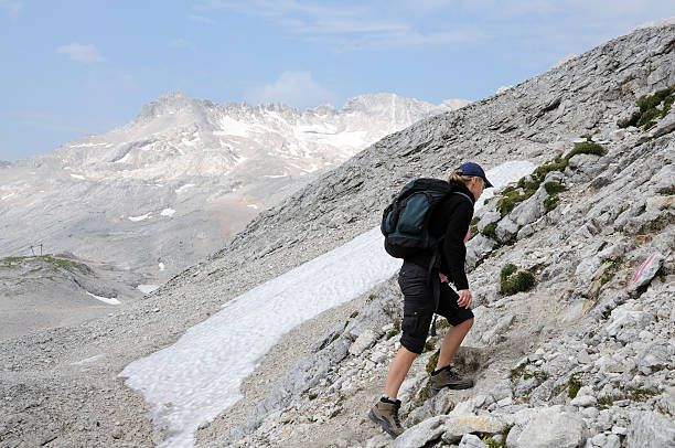 istock Young woman climbing in the mountains 151544051