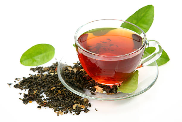 istock Tea in a glass cup on a matching plate 151544276