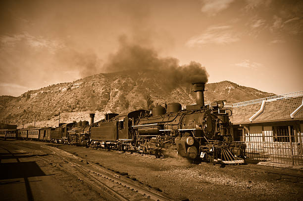 Antique steam locomotive in the American West stock photo
