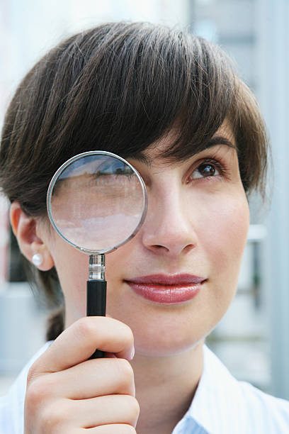 Bizness woman with magnifier stock photo