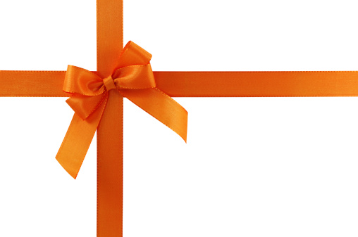 Orange gift bow on white background