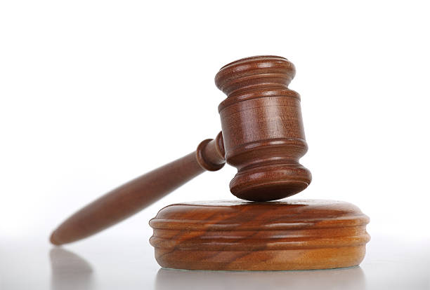istock wooden gavel with reflection on white 151546026