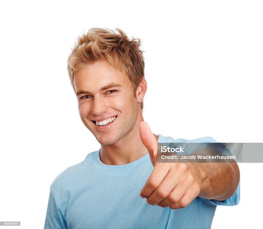 Happy young guy mostrando pulgar hacia arriba señales - Foto de stock de Pelo rubio libre de derechos