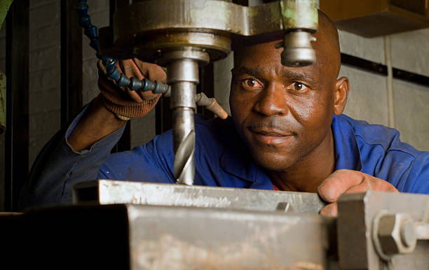 istock African American with drill press 151546804