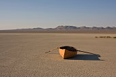 row boat in desert