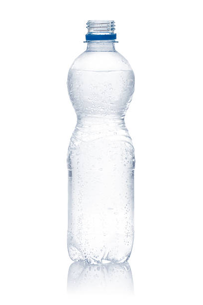 A large amount of stacked plastic bottles with a blue screw cap.