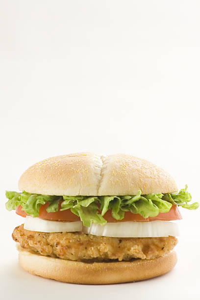 istock crisp chicken burger with tomato onion cheese lettuce 151548255