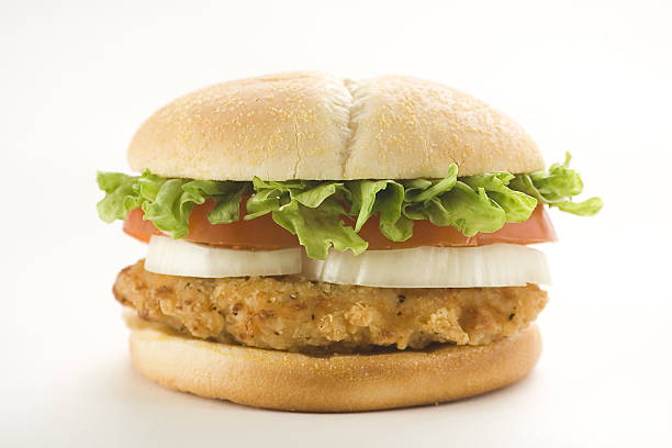 istock crisp chicken burger with tomato onion cheese lettuce 151548262