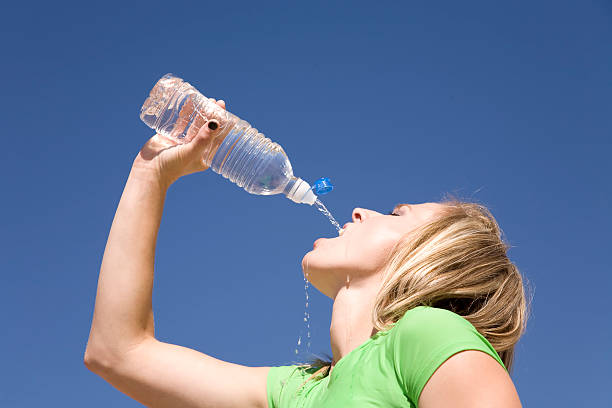 istock Woman and water bottle blue sky 151548467