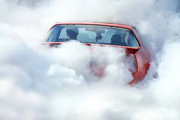 Photo of American car in smoke