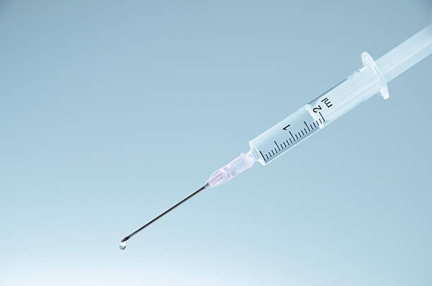 Syringe with fluid stock photo