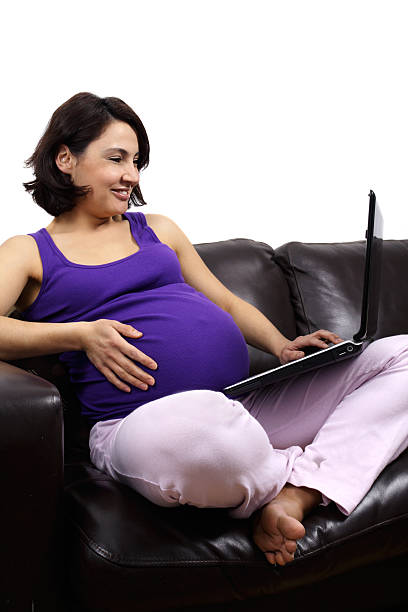 istock pregnant woman on couch 151549301