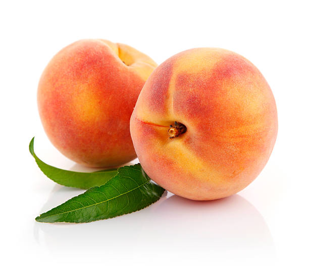 istock fresh peach fruits with green leaves 151549854