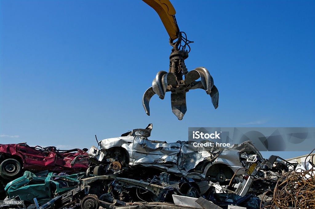 crane cars Crane picking up crushed cars Car Stock Photo