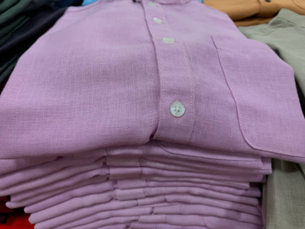 istock stack of folded pink shirt in cloths store display 1515527230