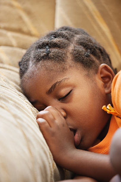 istock A young girl sleeping peacefully with her thumb in her mouth 151553677