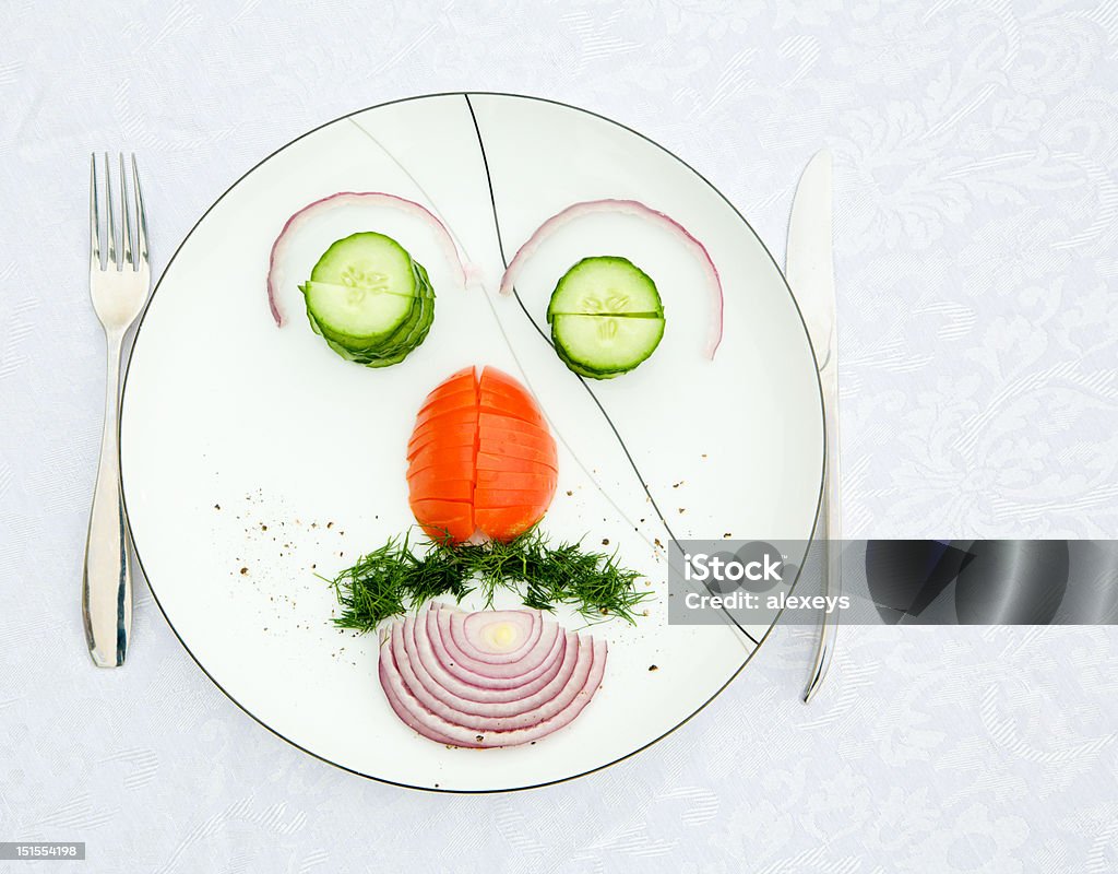 Salad Vegetable salad arranged on the place to form a face Arrangement Stock Photo