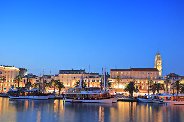 istock Split harbour depicting Diocletian's palace, by night 151554320