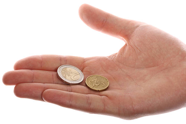 Two coins lie on the opened palm stock photo