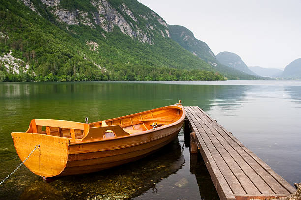 boat berth on lake bohinj slovenia stock photo