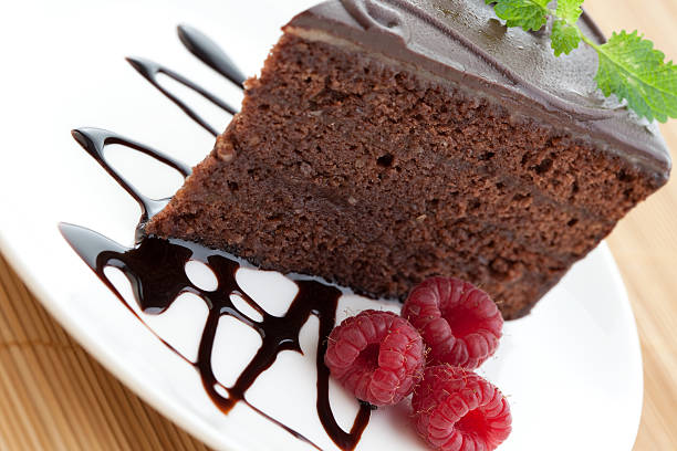 istock Slice of delicious chocolate cake with fresh raspberries 151555964