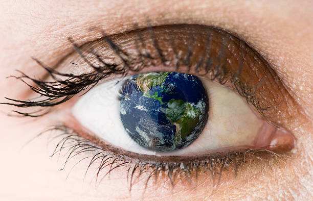 Close-up of one eye with the world as its pupil stock photo