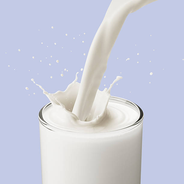 pouring milk stock photo