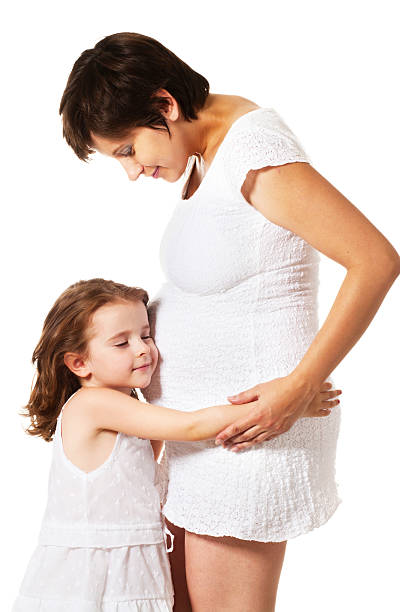 istock little girl hugging new sibling 151557507